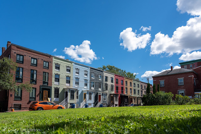 Portland Maine July 2022 The row houses of Stratton Place above a nice green lawn and below a bright blue sky. #PortlandME