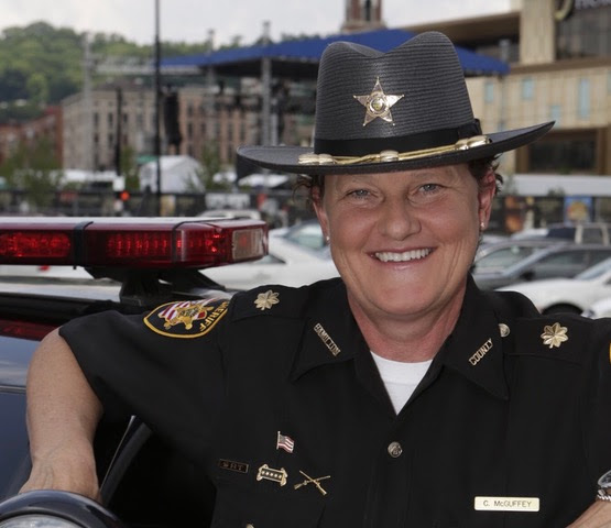 The sheriff fired her because she’s a lesbian so she ran against him. She’ll be the new sheriff now