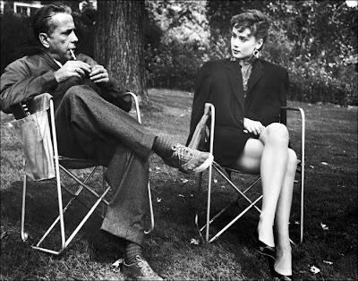 Humphrey Bogart and Audrey Hepburn on the set of Sabrina