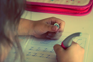 Image: Child learning to print, by StockSnap on Pixabay