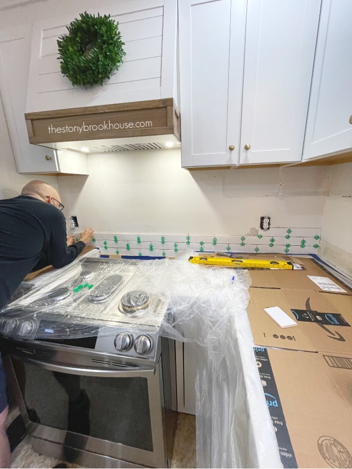 Tile begins on stove wall