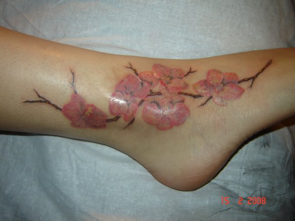 Girl Tattoos on lower back Feet Tattoos