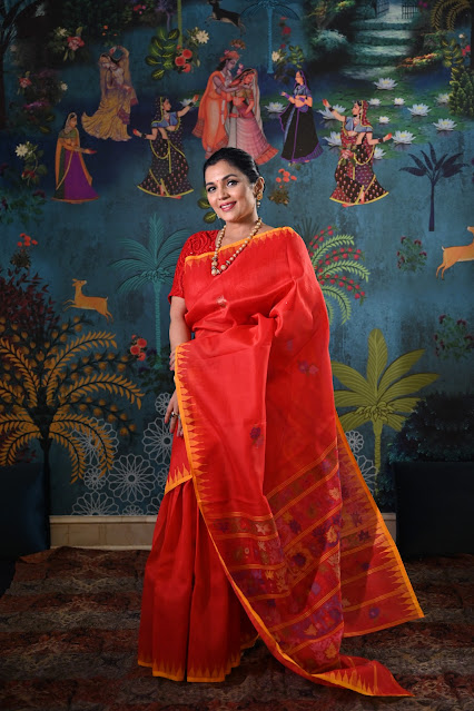 Red silk Rani phee saree from Manipur with a temple border and jamdani weave.