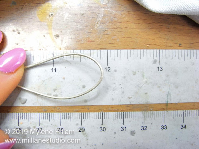 Measuring the leather cord for the bracelet.