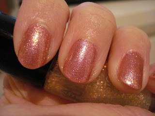 Closeup flaky glitter pink nail swatch