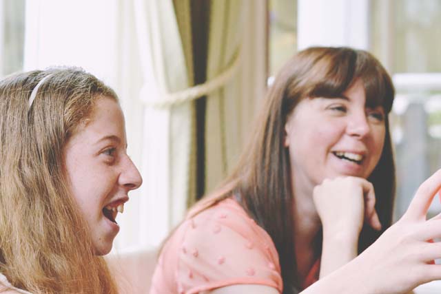 Laughing mother and daughter