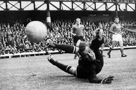 USSR goalkeeper Lev Yashin makes a superb save after a shot from Italian forward Alessandro "Sandro" Mazzola at the 1966 World Cup. Italy-USSR match (16 July 1966), where Yashin saved a penalty