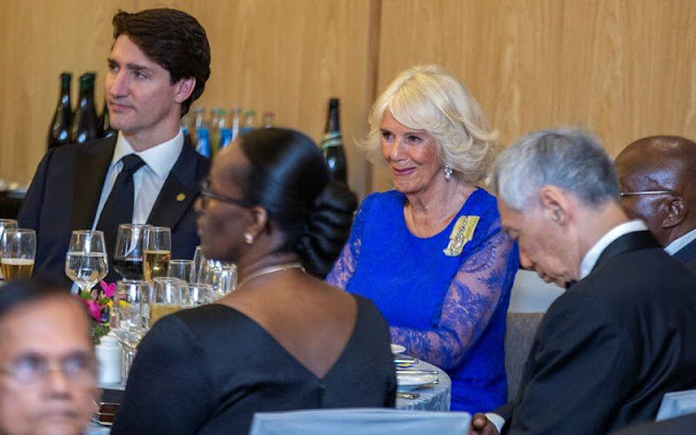 Duchess of Cornwall wore a royal blue lace gown, and a printed shirt dress. Jeannette Kagame, Carrie Johnson and Justin Trudeau