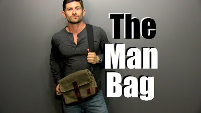 This picture is showing a man with a side bag