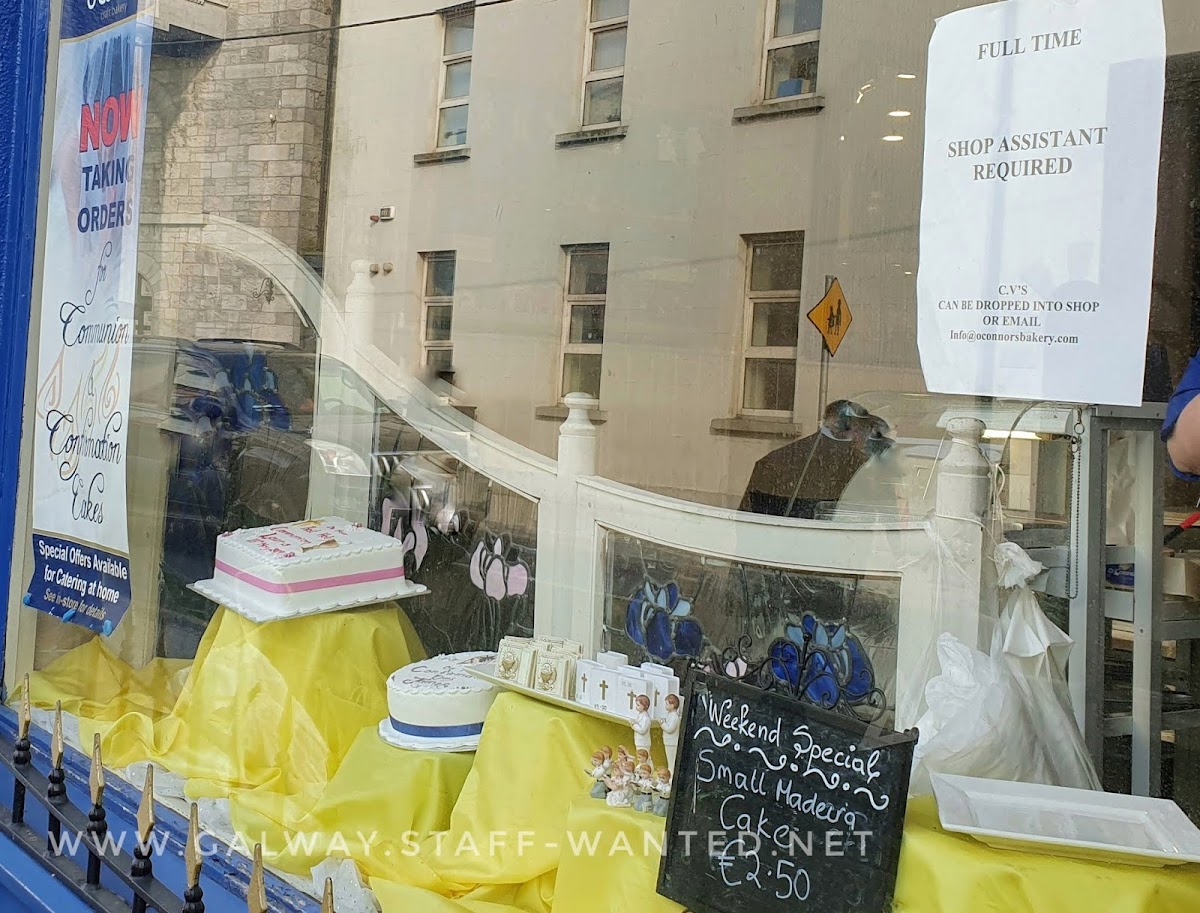 Cake shop window - job ad and weekend special:  small Madeira cake for €2.50