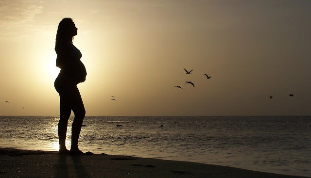 Image: Pregnant Woman on the Beach