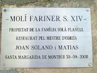 Placa a l'entrada del Molí de Dalt