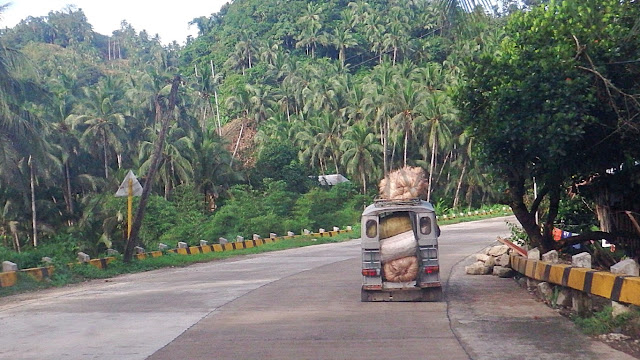 a tricycle called "center car" on the highway from Lope De Vega to Catarman Northern Samar