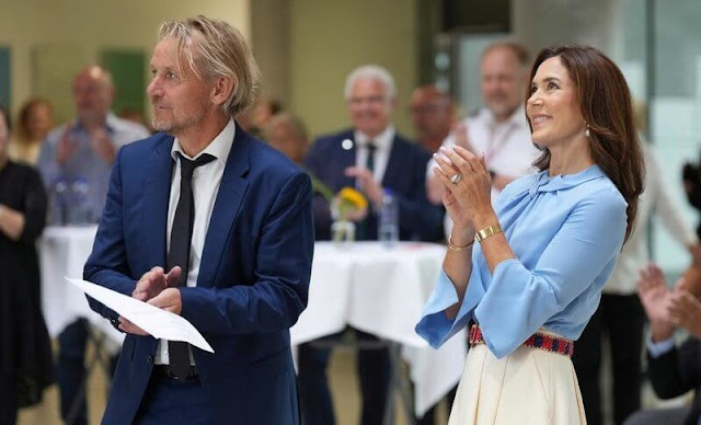 Crown Princess Mary wore a flare sleeve knot blouse by Victoria Beckham, and an ivory silk skirt by Birger et Mikkelsen