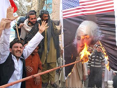 Afghan Activists burn a picture of George Washington