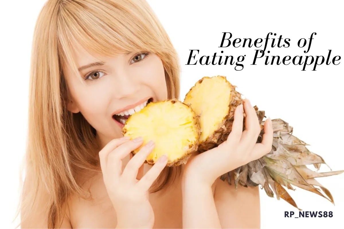 Beautiful girl eating pineapple fruit