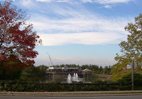 Logan's restaurant as shot from the road, all 3 fountains visible in the retention pond