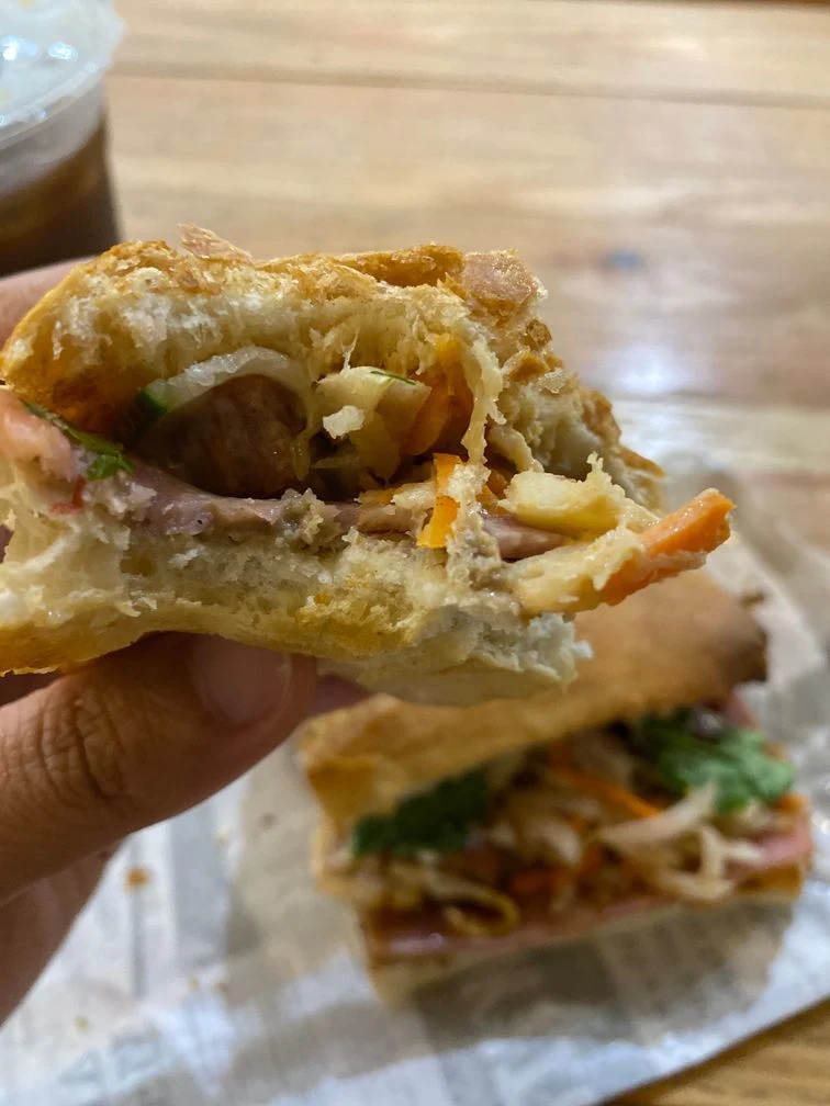 eating sandwich at Banh Mi Kitchen