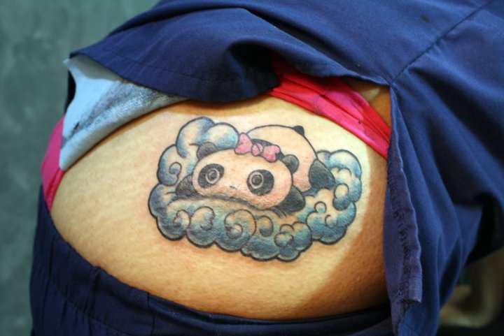 Tare panda tattoo covering up an unwanted birthmark.