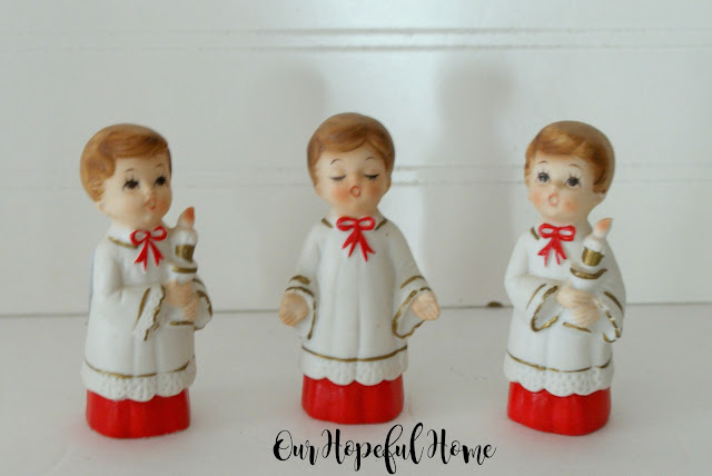 Vintage porcelain choir boys in robes with candles made in Japan.