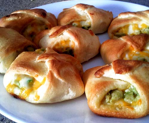 Crescent rolls stuffed with avocado, chicken, and cheese.