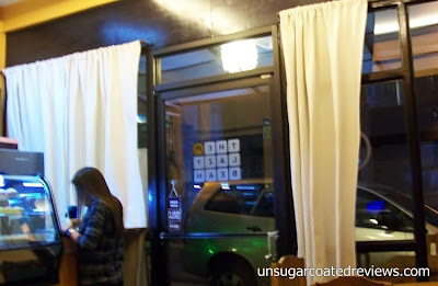 glass door entrance and wall at The Lazy Bean