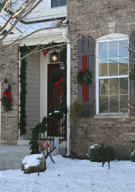 greenery and lights outside Christmas decor 