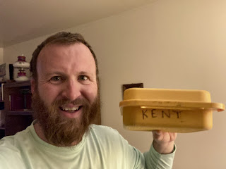Good-looking bearded man holding a box from his childhood