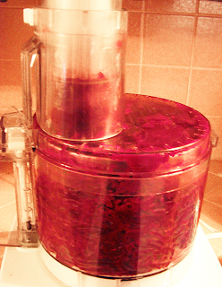 Food Processor Filled with Grated Beets