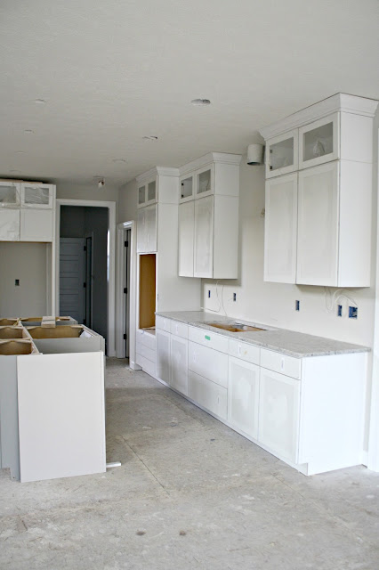 gray island white cabinets