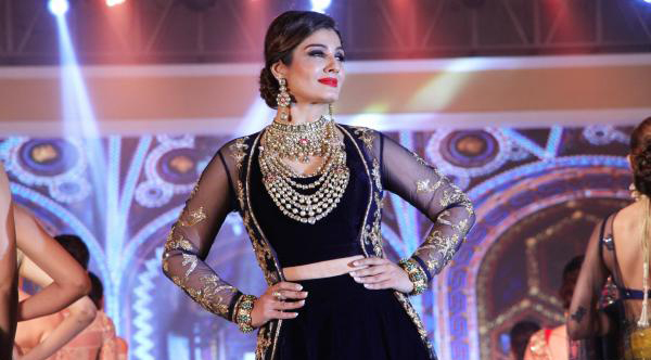 Raveena Tandan in Navy Blue Velvet Lehenga Choli with Long Jacket at IBJA Fashion Show