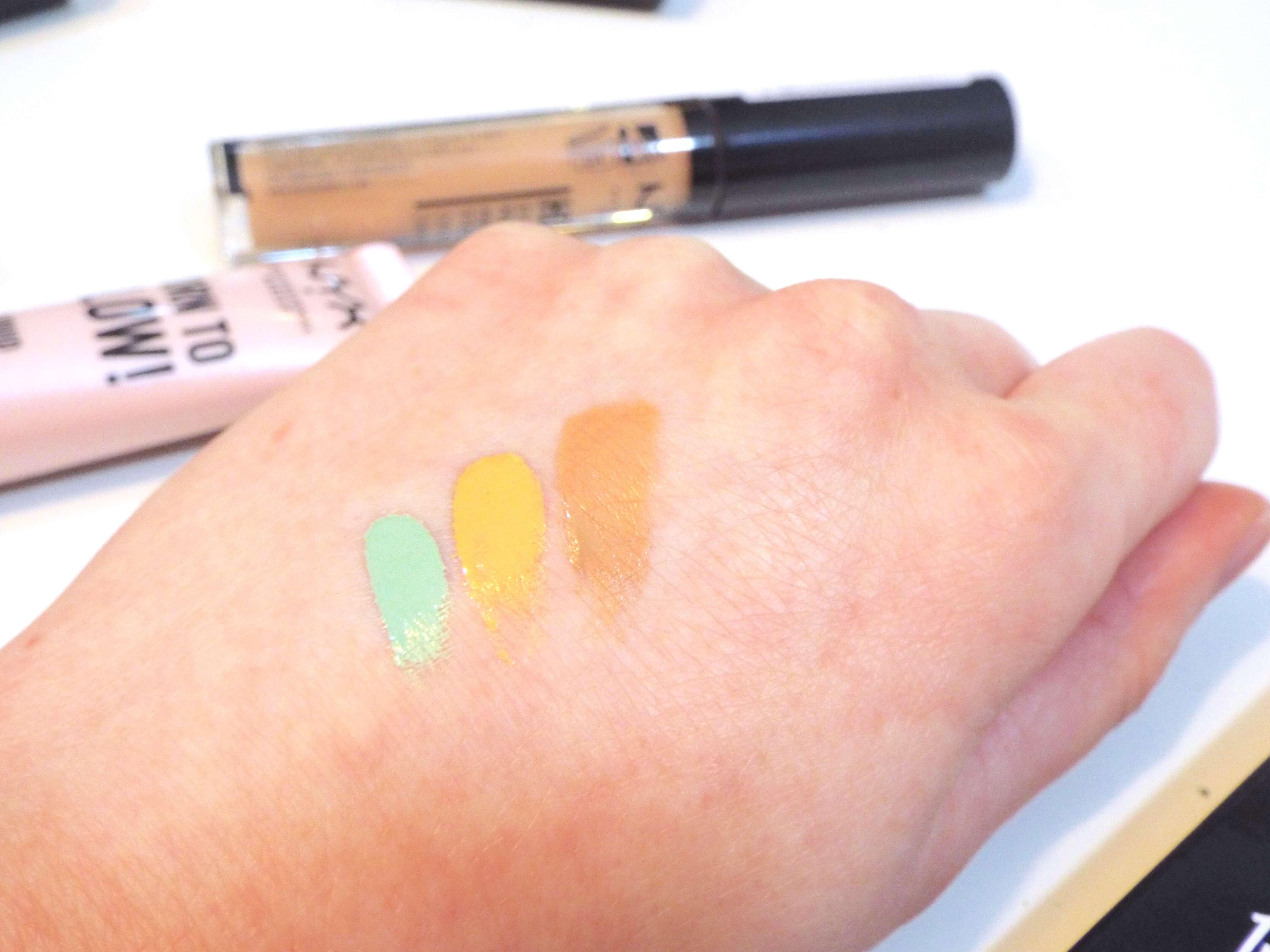 The three NYX HD Concealers swatched, from green to yellow and finally a deep nude shade.