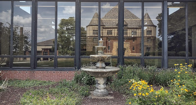 Fountain and reflection of Sullivan Hall in Reeves front windows