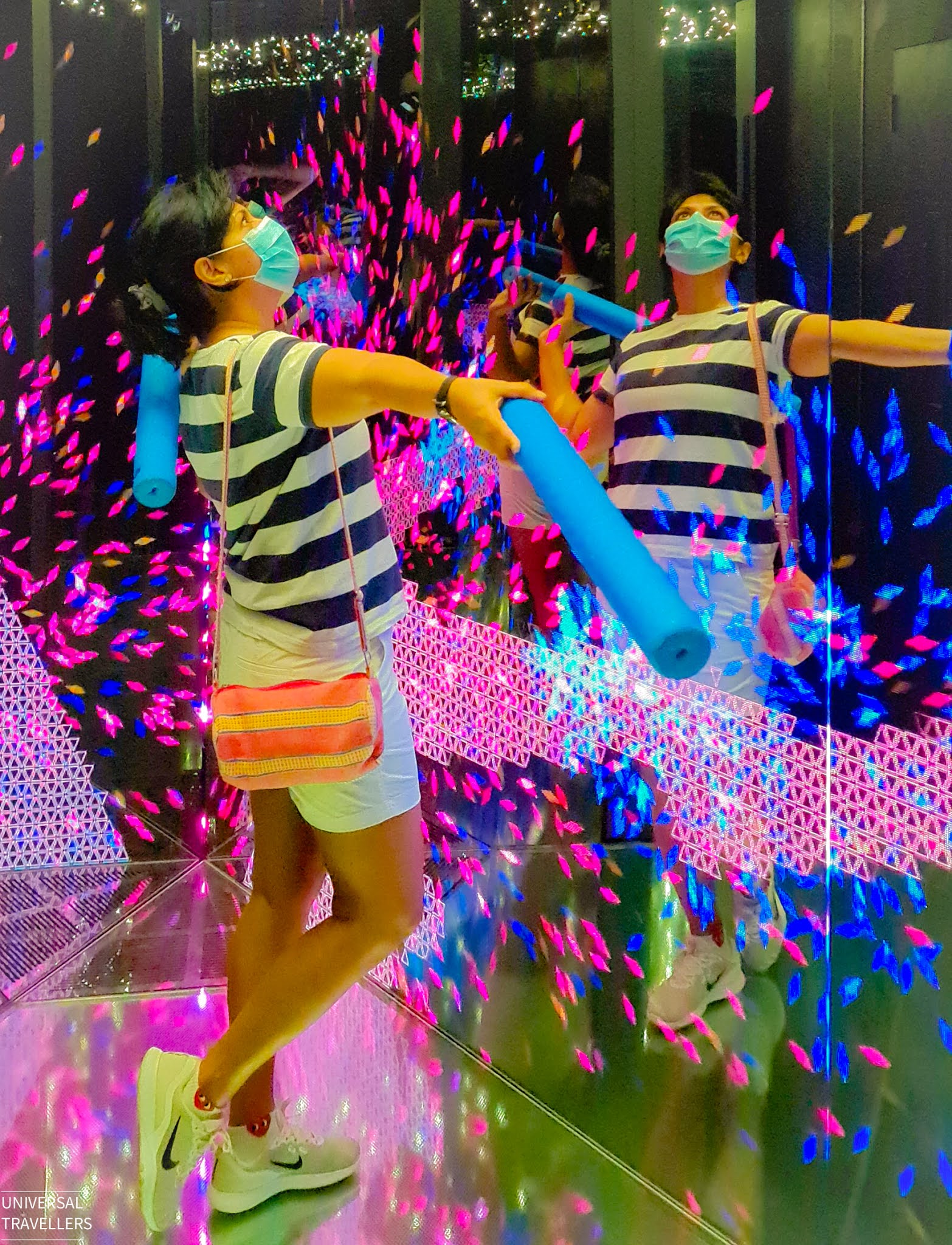 Girl is enjoying the kaleidoscopic variations inside the Mirror Maze, located at level 5 inside the Jewel Changi Airport