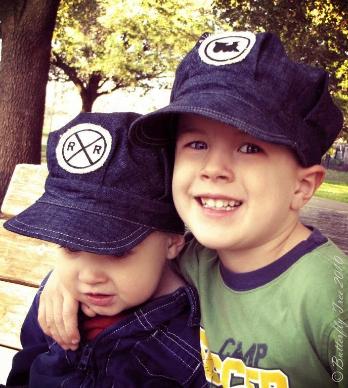 image Train Lovers Engineer Hat Pattern Shows baby and child size one with railway crossing, other with train silhouette