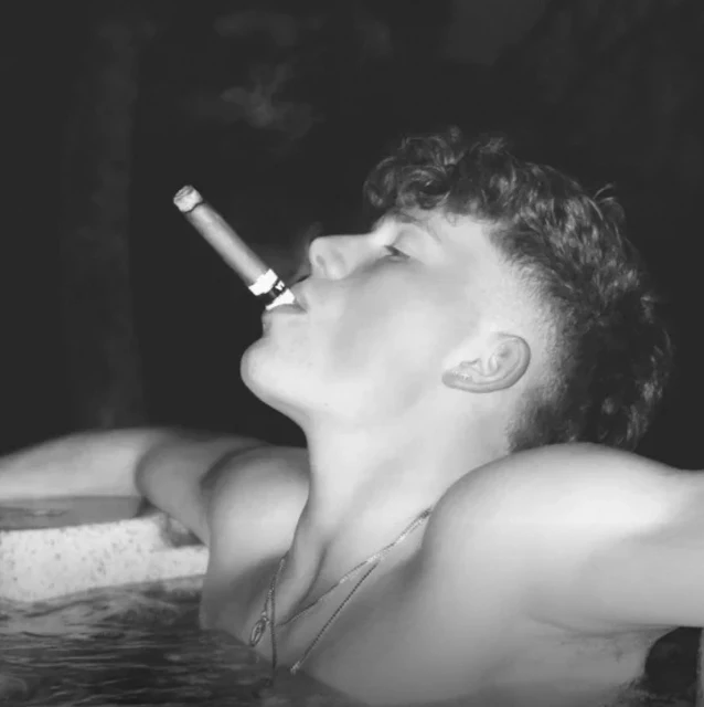 Like my photograph of a hot dude with curly hair with a cigar sitting in the hot tub