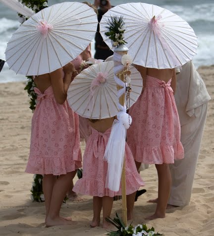 THE PERFECT ACCESSORY FOR BEACH WEDDINGS Colored Parasols not only are a 
