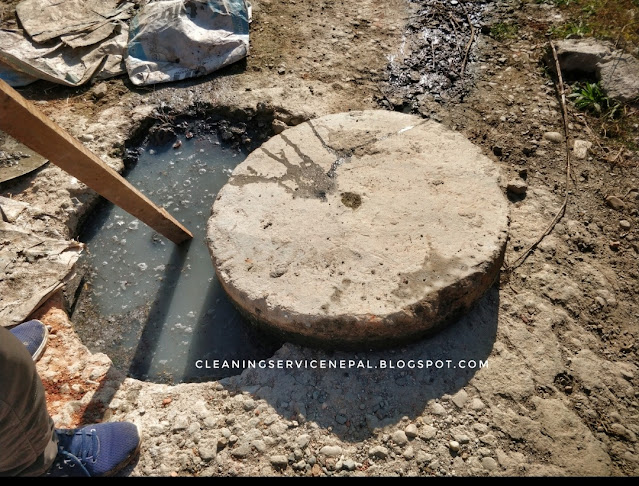 a man unblocking drain line