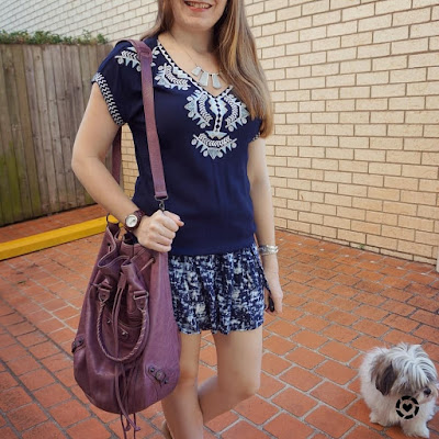 awayfromblue instagram embroidered navy tunic monochrome outfit with printed shorts Balenciaga pompon bag