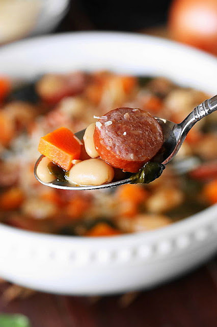 Spoonful of White Bean & Kielbasa Soup with Spinach Image