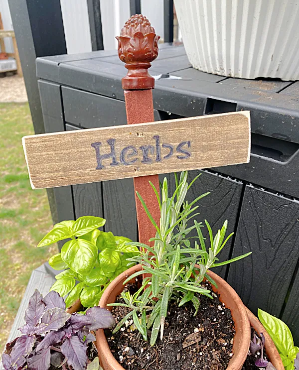 herb sign with finial