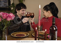 couple enjoying candle light dinner