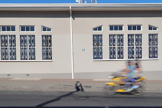 blurred motorcycle in front of muni building in Puriscal