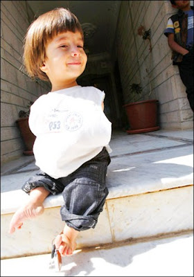 Ali Srour poses with his brothers at his parents' home in Amman