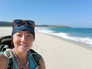 Kara on a beach along the coast near Lires, Spain