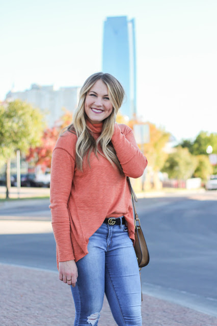 girl wearing orange sweater in okc