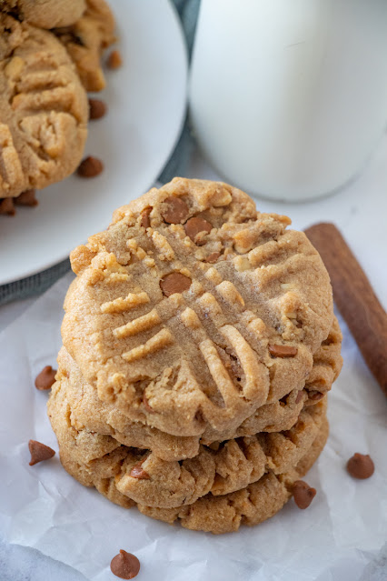 stack of cookies with cinnamon chip and cinnamon stick garnish.