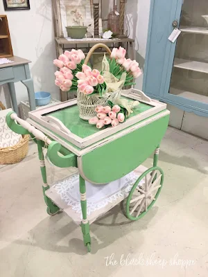 Whimsical painted antique tea cart.