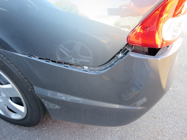 Rear bumper hanging down after collision