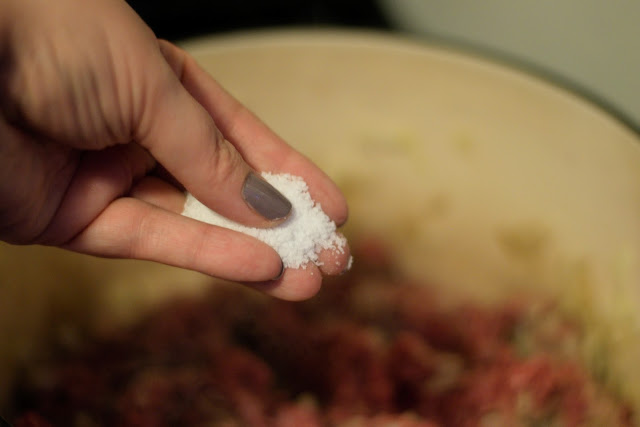 Salt being added to the pot.